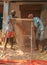 Indian worker Sieving Sand for construction Purpose.