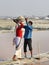 Indian workers putting basin with salt on head of woman on Sambhar Salt Lake. Rajasthan. India