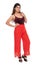 Indian you girl with red velvet camisole and loose pant with elegant pose and expression