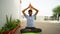 Indian young boy meditating at home. Portrait of Asian cute boy practicing yoga on home background. Worldwide yoga day concept