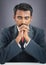 Indian young businessman praying