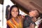 Indian young girl in colorful Rajasthani dress posing with hir brother