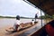 Indians overtakes tourist canoe, Rio Napo