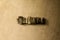 INDICATE - close-up of grungy vintage typeset word on metal backdrop