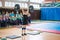 Indicative performance of weightlifters at the championship in cheerleading,young girl lifts a heavy barbell, barbell weight - 60