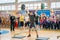 Indicative performance of weightlifters at the championship in cheerleading, young man lifts a heavy barbell, barbell weight - 100