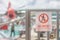 Indicator sign. No entry. Sign on the fence wooden gate with blurred airplane wings rotor plane