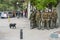 Indifferent dos crossing sidewalk with police clashes with protesters at Santiago de Chile city streets during October 2019 riots