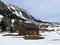Indigenous alpine huts and wooden cattle stables on Swiss pastures covered with fresh white snow cover, Wildhaus - Obertoggenburg