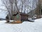 Indigenous alpine huts and wooden cattle stables on Swiss pastures covered with fresh white snow cover, Wildhaus - Obertoggenburg