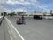 Indigenous mother and children on board a pedal tricycle crossing the low-cost metropolitan highway long bridge