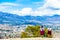 Indigenous people in fron of the cityscape of Cochabamba in Bolivia