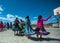 Indigenous school student group dance in traditional colorful dress on playground, Mexico, America