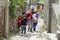 Indigenous woman and kids in the narrow streets of San Isidro, Argentina