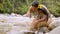 Indigenous woman washing her face