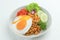 Indomie Goreng, Instant Fried Noodle Popular from Indonesia. Served with Carrot, Cucumber, Tomato, Shallot, Lettuce, and Fried Egg