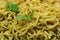 Indomie Goreng Instant Fried Noodles Popular in Indonesia. Background Fried noodles with celery. Full frame
