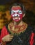 Indonesia, June 13 2022 - Men paint their faces in preparation for going on stage