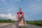 Indonesia, March 15, 2024 - Bronze statue of Soekarno holding a stick under the blue sky