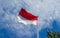 Indonesia and Monaco national flag with bluesky background