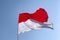 Indonesia and Monaco national flag with white cloudy sky background
