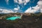 Indonesia volcano rocks crater lakes on green mountain Kelimutu peak, turquoise water, Flores island