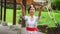 Indonesian balinese girl throw a flower. Wearing traditional national clothes.