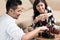 Indonesian couple playing chess at home