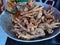 Indonesian cuisine rica-rica spicy chicken feet on a pan