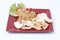 Indonesian dish : fried rice  nasi goreng served prawn crackers on red plate