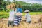 Indonesian farmer man sifting rice in the fields of Ubud, Bali. A common practice done in rural China, Vietnam, Thailand