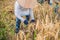 Indonesian farmer man sifting rice in the fields of Ubud, Bali. A common practice done in rural China, Vietnam, Thailand