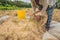 Indonesian farmer man sifting rice in the fields of Ubud, Bali. A common practice done in rural China, Vietnam, Thailand