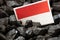 Indonesian flag on coal background, Concept of Mining and coal extraction in Indonesia, Rising commodity prices in the world,