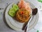 Indonesian food, Nasi Goreng kampung or fried rice, served with cucumber and crackers