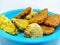 Indonesian market snacks consisting of onde-onde, brittle and fried green beans on a white background