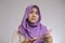 Indonesian muslim woman confused how to spend her money earning