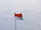 The Indonesian national flag, red-white, flying in space, mighty