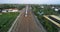 Indonesian passenger train KAI traveling on the rail from aerial view