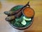 Indonesian popular dish named Pecel Lele or fried catfish served with chili sauce and raw vegetable