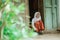 Indonesian primary school student getting ready to school in the morning