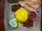 Indonesian ramadan rice lunch box called Aneka Nasi Kotak. An iftar snack gift.