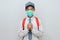 Indonesian Senior Student wearing uniform and protection face mask against coronavirus doing pray for corona virus is quickly