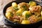 Indonesian spicy chicken coconut curry with potatoes close-up in a frying pan. horizontal