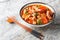 Indonesian stewed pork belly with tomatoes, onions, sweet soy sauce and Asian spices close-up in a bowl. Horizontal