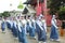 Indonesian students walking and marching on the street using uniforms in celebrating the country's Independence Day