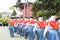 Indonesian students walking and marching on the street using uniforms in celebrating the country's Independence Day