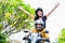 Indonesian woman feeling free on motorcycle