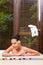Indonesian woman having wellness bath in spa