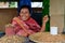 Indonesian Woman Selling Dried Fishes